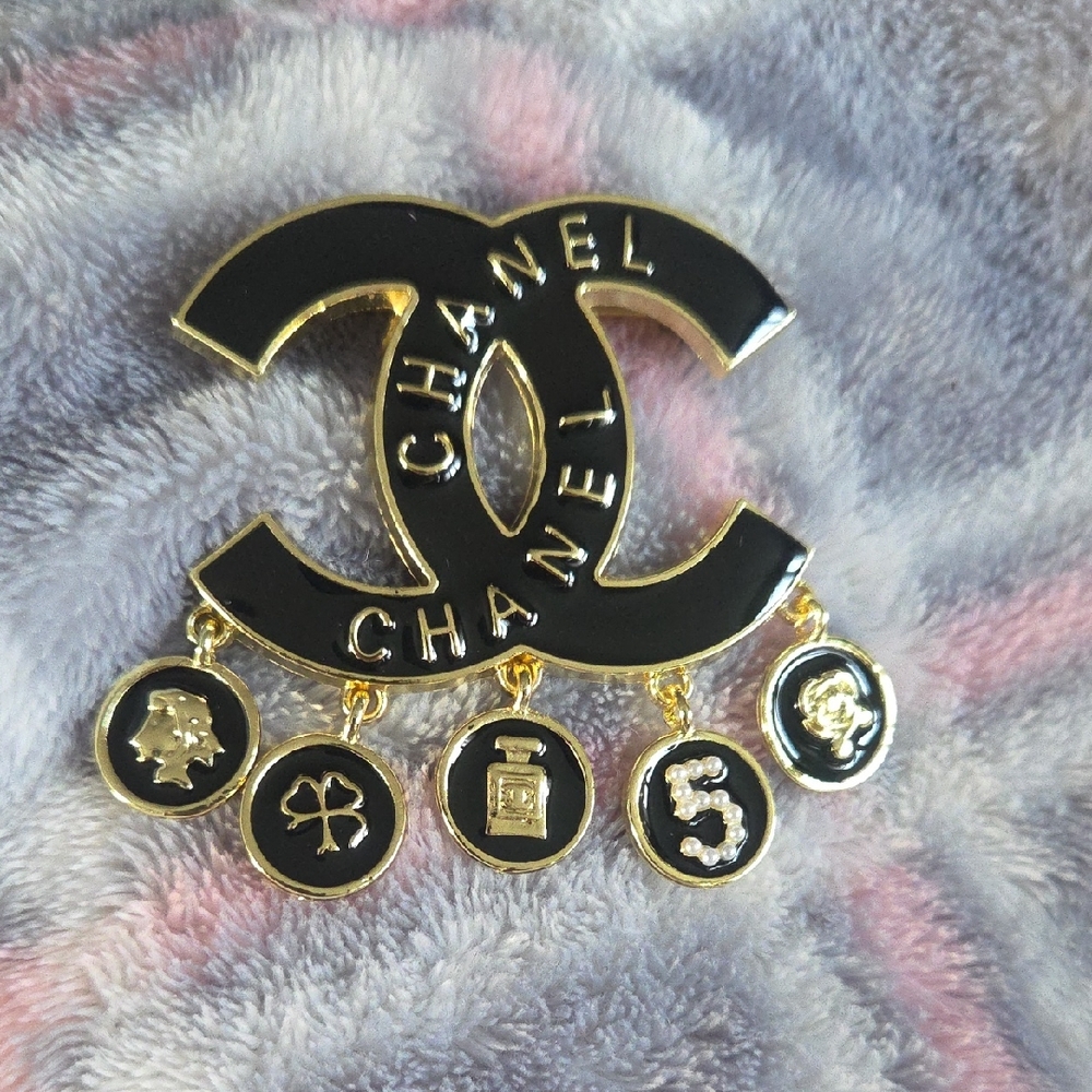 Stamped CHANEL Black and Gold Iconic Charm Brooch